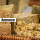 Stock photo of gourmet dairy food market chunks of Stilton cheese / soft crumbly, creamy white blue cheese pieces and cubes to sample, taste and test in basket, made with Penicillium roqueforti mould / mold fungus to make blue veins, like Roquefort / Gorgonzola